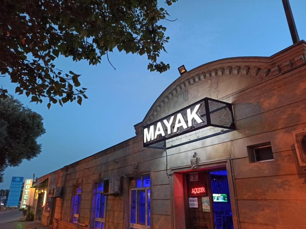 a building with a sign that reads mayak on it at Sunny Hostel - Günəşli Hostel in Baku