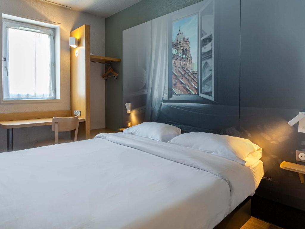 Postel nebo postele na pokoji v ubytování B&B HOTEL Strasbourg Nord Artisans