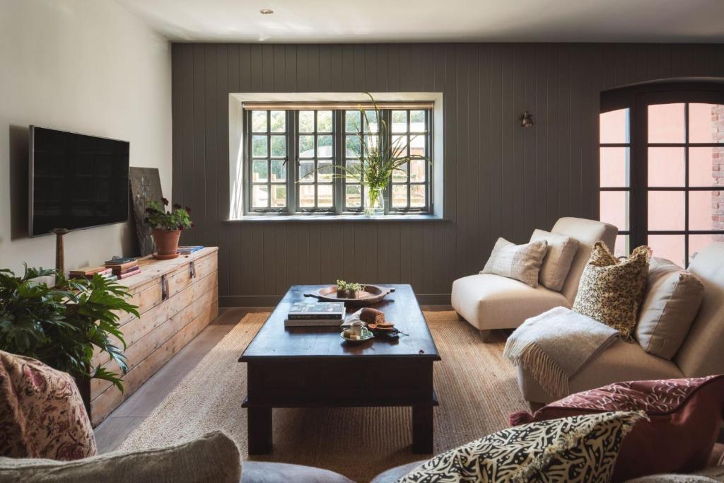 a living room with a couch and a coffee table at Exe Valley Retreat in Exeter