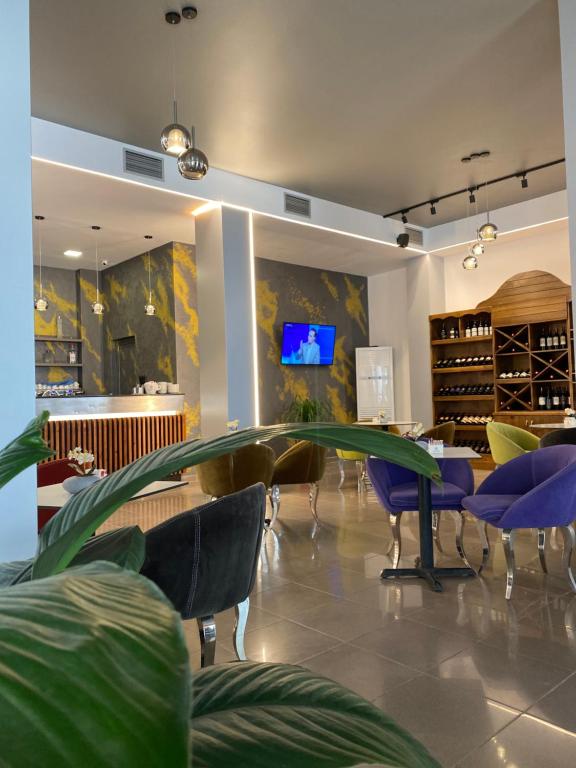 TV a/nebo společenská místnost v ubytování Atrium Deluxe Resort