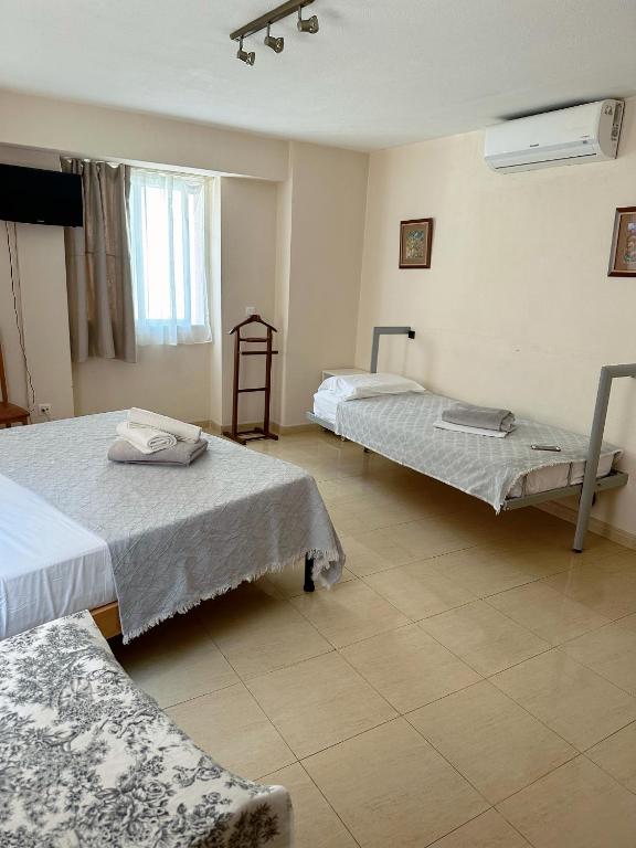 Postel nebo postele na pokoji v ubytování Royal Inn Aparthotel