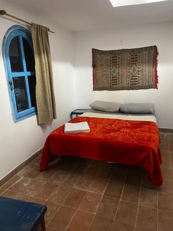 Postel nebo postele na pokoji v ubytování Dar El Pirata Hostel