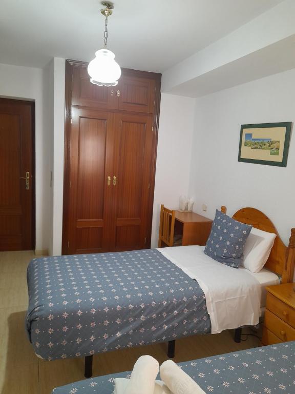 Postel nebo postele na pokoji v ubytování Hostal Salomé