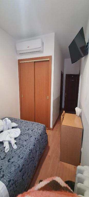 Postel nebo postele na pokoji v ubytování Hostal Salomé