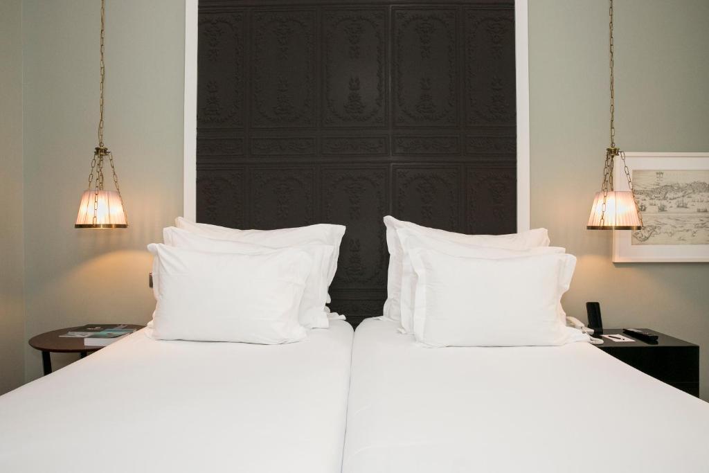 Postel nebo postele na pokoji v ubytování Pousada de Lisboa - Small Luxury Hotels Of The World