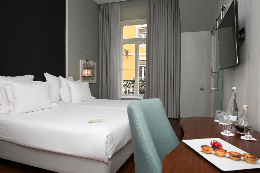 Postel nebo postele na pokoji v ubytování Pousada de Lisboa - Small Luxury Hotels Of The World