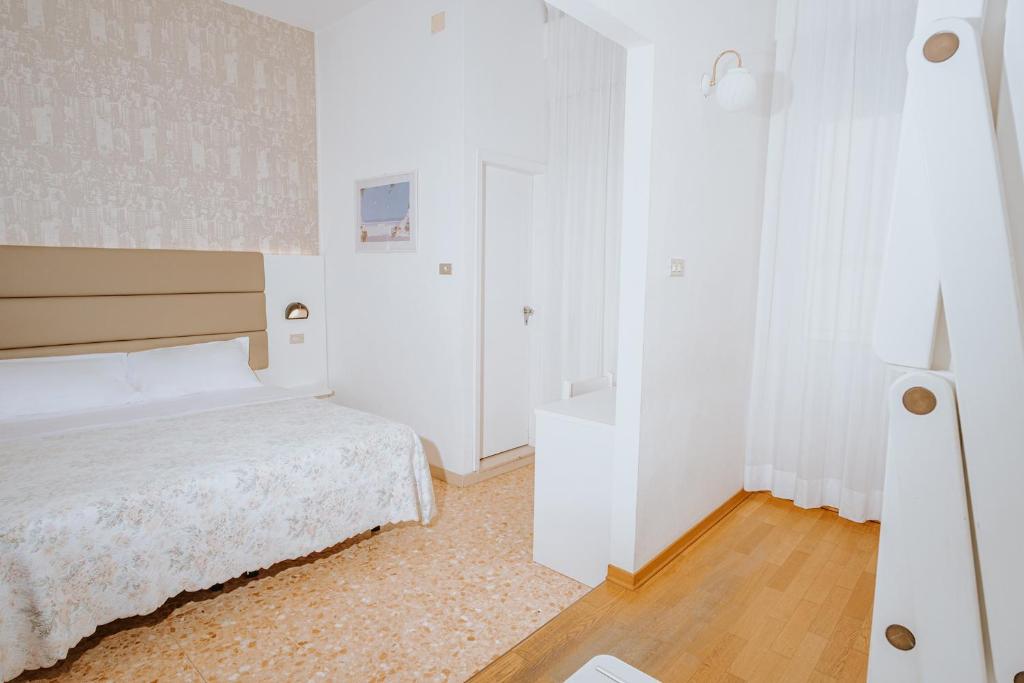 Postel nebo postele na pokoji v ubytování Hotel Gabriella
