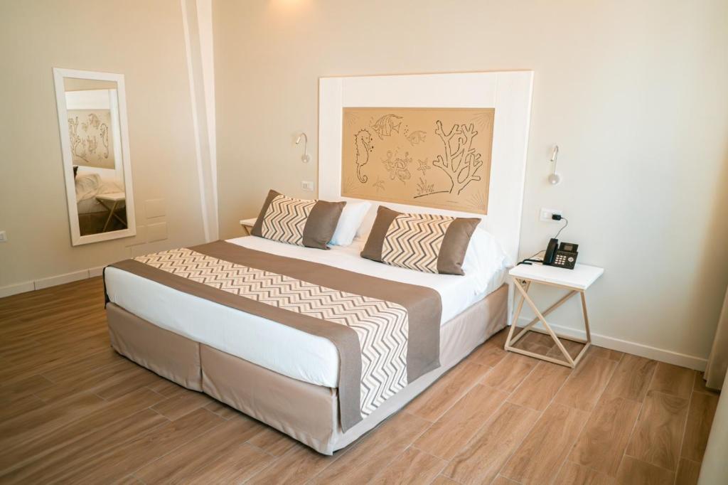 Postel nebo postele na pokoji v ubytování Hotel Lido Beach PHG