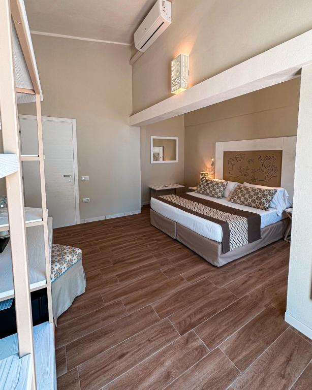 Postel nebo postele na pokoji v ubytování Hotel Lido Beach PHG