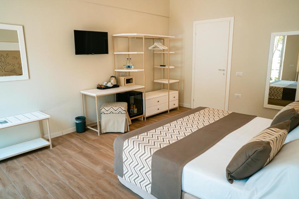 Postel nebo postele na pokoji v ubytování Hotel Lido Beach PHG