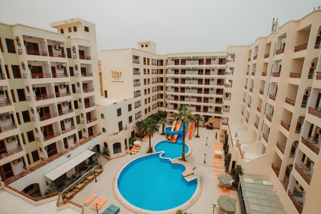 an aerial view of an apartment complex with a swimming pool at Empire Hotel Aqua Park in Hurghada