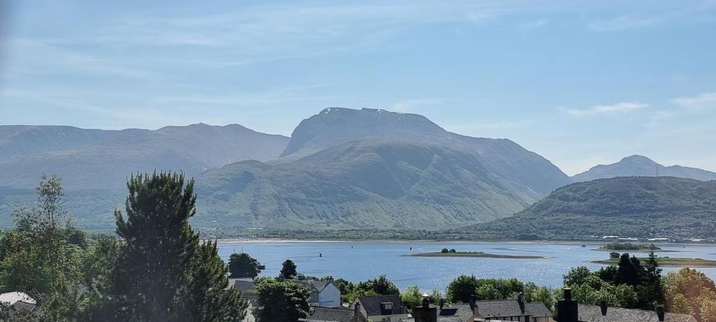 a view of a lake with mountains in the background at Benview House in Corpach