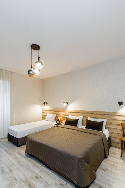 Postel nebo postele na pokoji v ubytování Rasta Maidan Hotel
