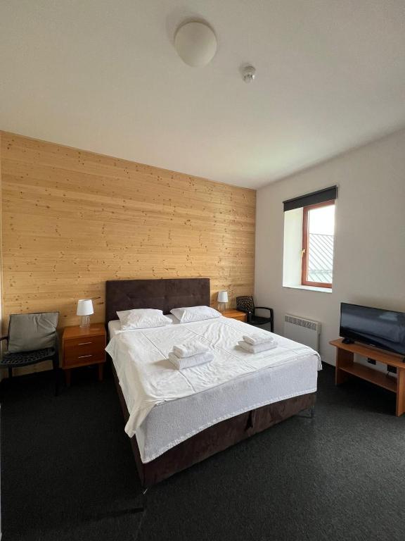 Postel nebo postele na pokoji v ubytování Kvildahotel