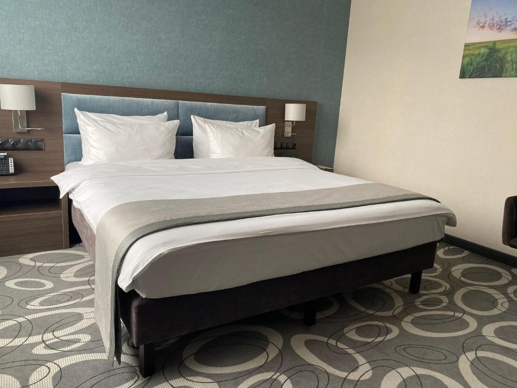 Posteľ alebo postele v izbe v ubytovaní Holiday Inn Dąbrowa Górnicza-Katowice by IHG