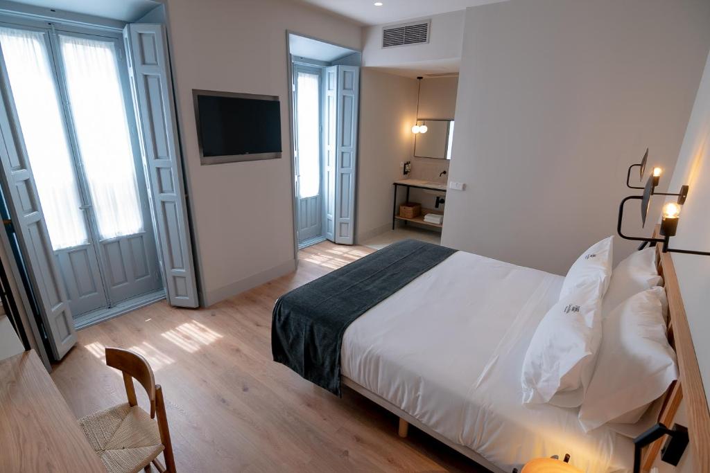 Postel nebo postele na pokoji v ubytování Casa del Médico Hotel Boutique