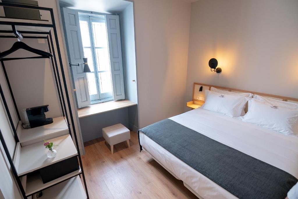 Postel nebo postele na pokoji v ubytování Casa del Médico Hotel Boutique