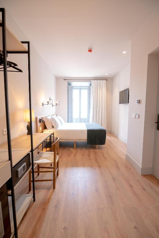 Postel nebo postele na pokoji v ubytování Casa del Médico Hotel Boutique