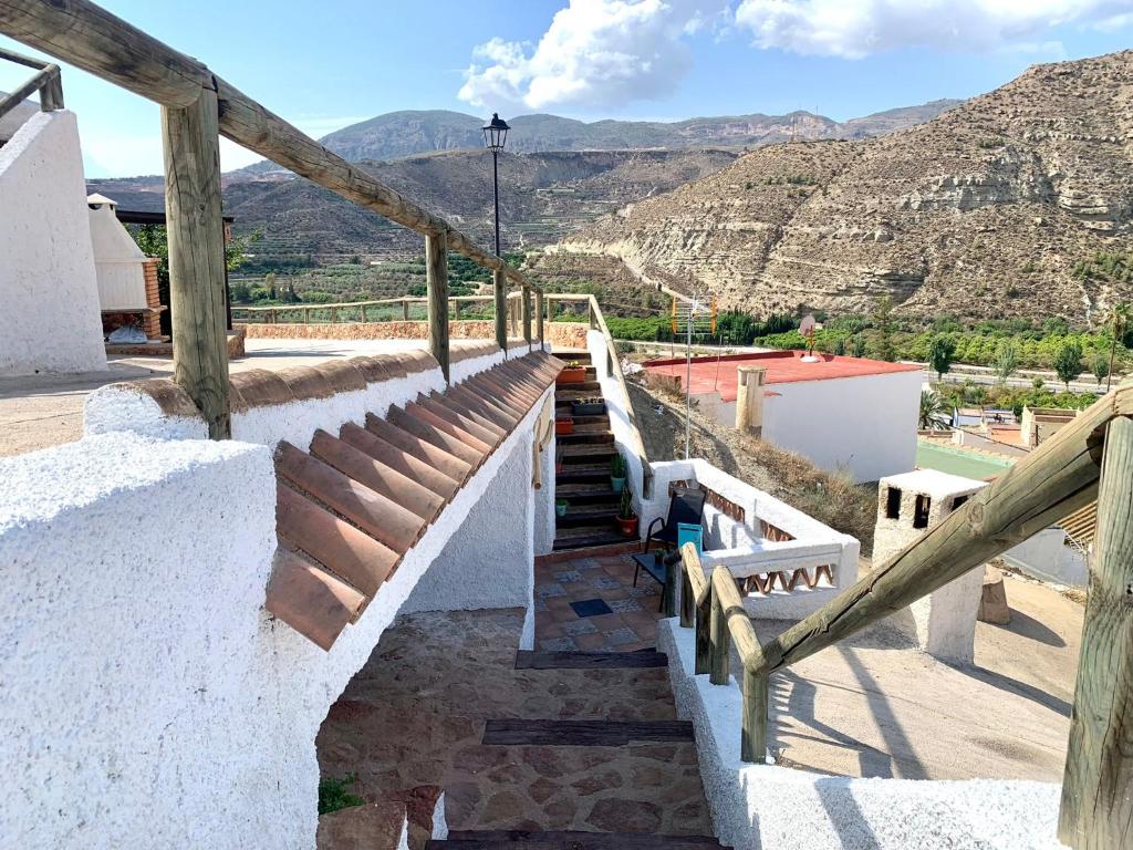 a set of stairs with a view of the mountains at Casa Cueva LA PARRA. in Terque