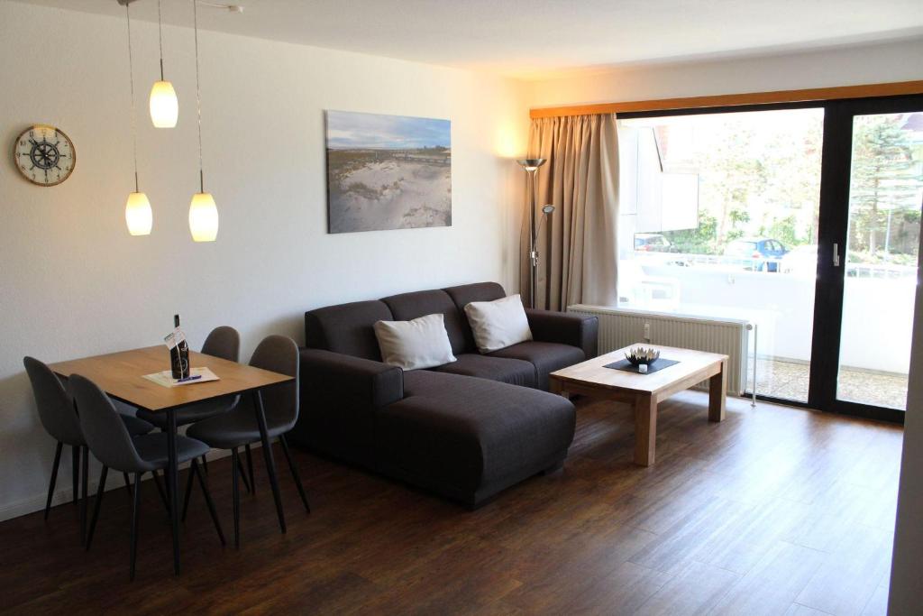 a living room with a couch and a table at Germania-30 in Böhl