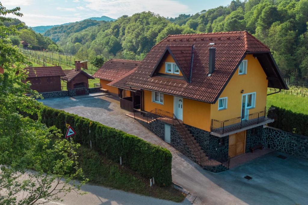 a yellow house with a red roof at Holiday Home Lanita with Two Bedrooms & Terrace 