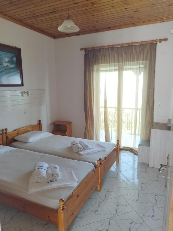 Postel nebo postele na pokoji v ubytování VILLA AGIA AIKATERINI
