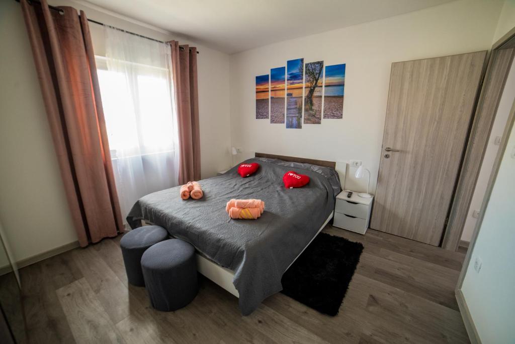 Postel nebo postele na pokoji v ubytování Apartman Laura