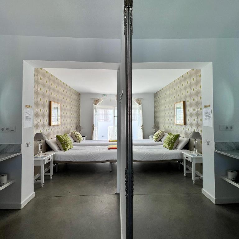 Postel nebo postele na pokoji v ubytování Chipibeach B&B, Hostal Boutique