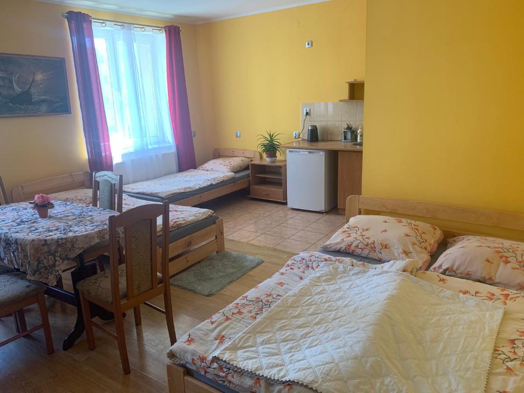 Postel nebo postele na pokoji v ubytování GWIAZDA MORZA