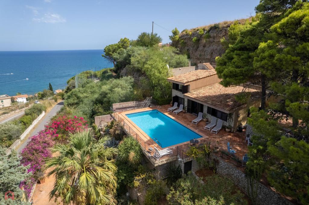 an aerial view of a house with a swimming pool at Stunning seaview villa in Altavilla Milicia