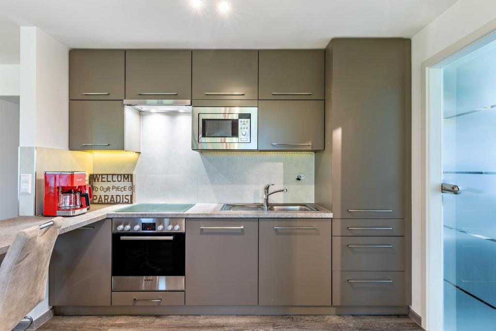 Kuchyň nebo kuchyňský kout v ubytování Ferienwohnung Eulennest