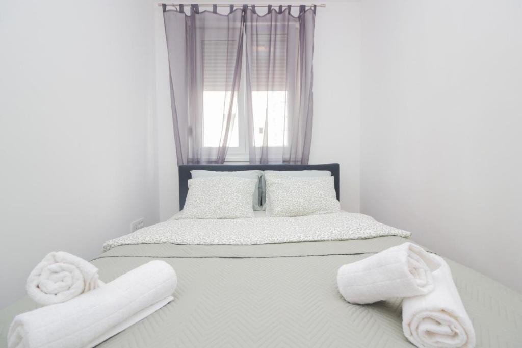 Posteľ alebo postele v izbe v ubytovaní Apartman Tesla Zadar