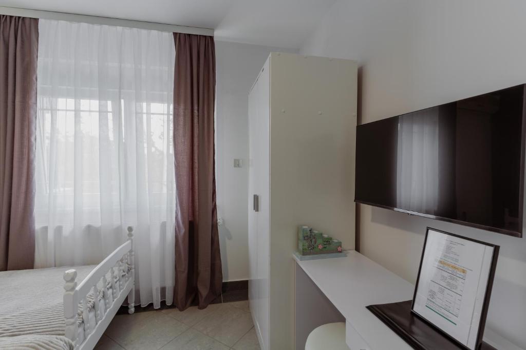 Postel nebo postele na pokoji v ubytování Apartmani "A View to the Danube"