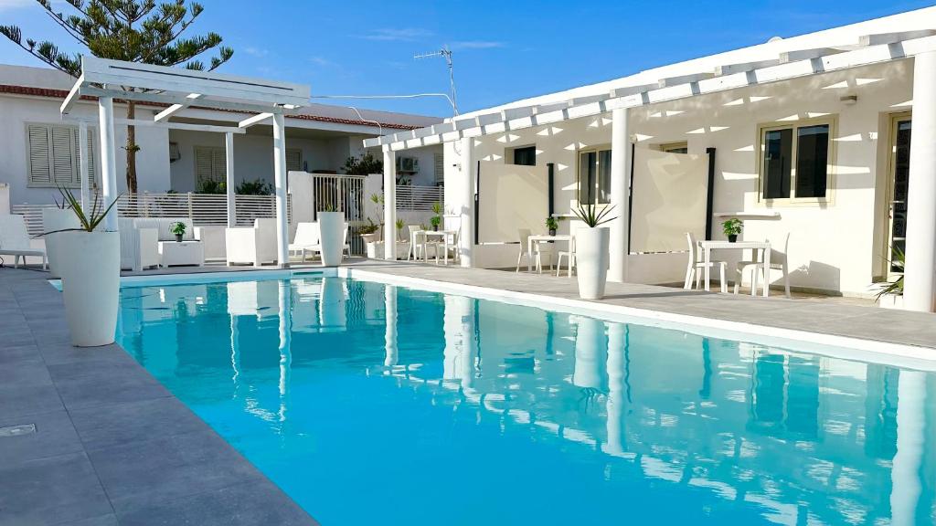 a swimming pool in front of a house at Case vacanze ''Estremo Sud'' Lampedusa in Lampedusa