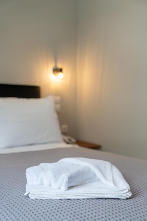 Postel nebo postele na pokoji v ubytování New Amaryllis Hotel