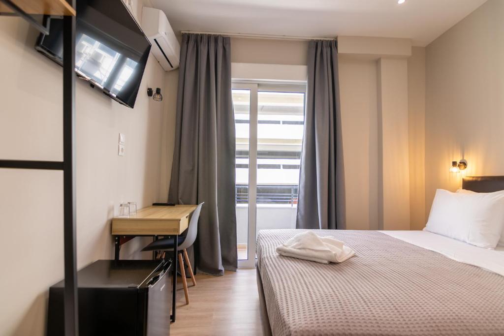 Postel nebo postele na pokoji v ubytování New Amaryllis Hotel