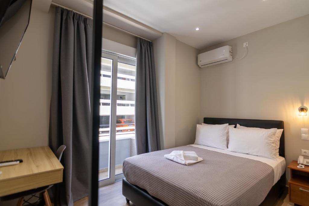 Postel nebo postele na pokoji v ubytování New Amaryllis Hotel