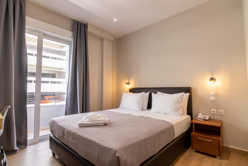 Postel nebo postele na pokoji v ubytování New Amaryllis Hotel