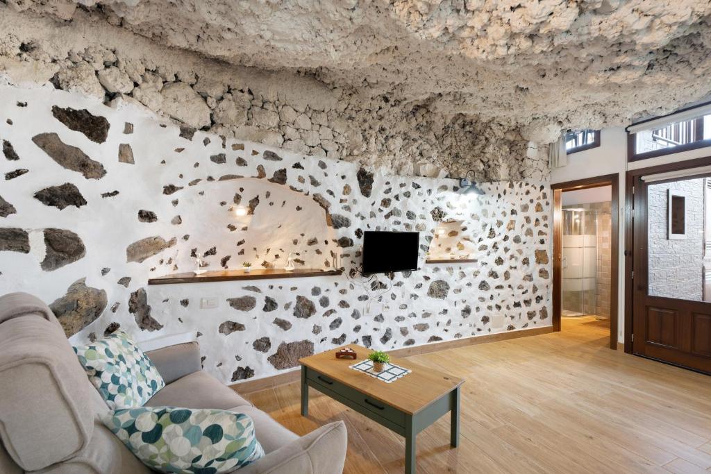 TV a/nebo společenská místnost v ubytování Cueva El Desvelo