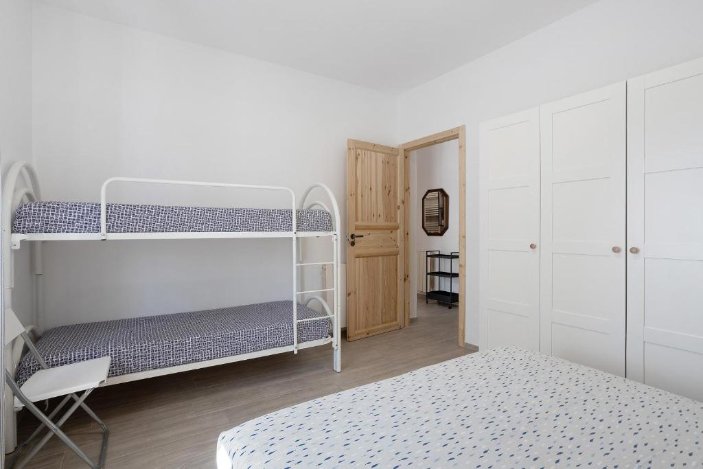 Posteľ alebo postele v izbe v ubytovaní Appartamento 4