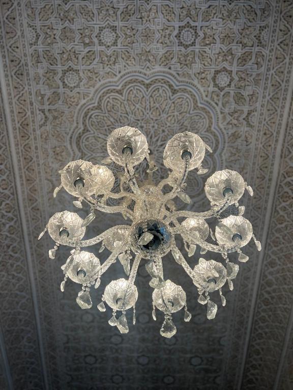 a chandelier hanging from a ceiling in a room at Riad Del Rey in Rabat