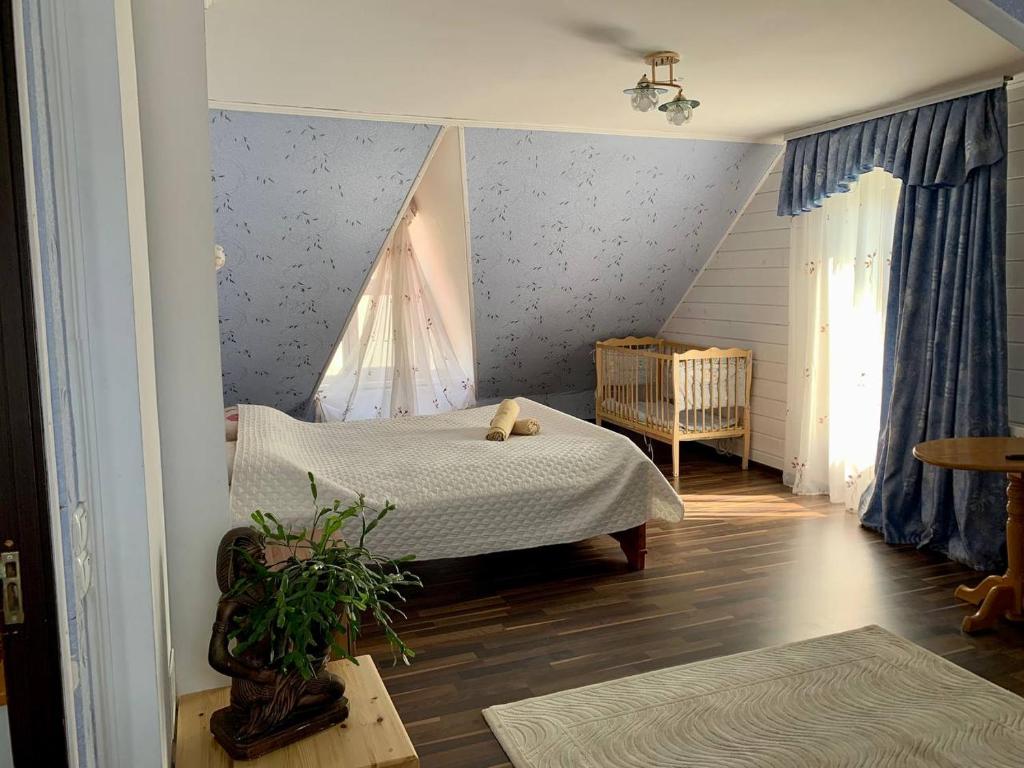 a bedroom with two beds and a window at Садиба Мигове in Migovo