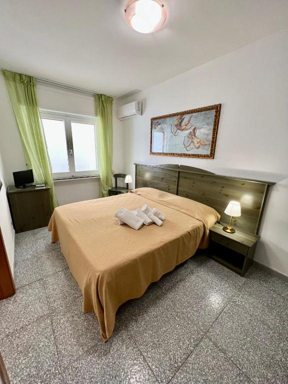 Postel nebo postele na pokoji v ubytování Hotel Minerva