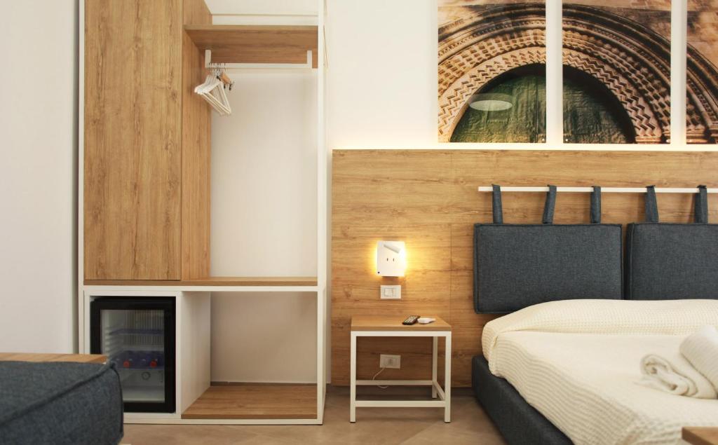 Postel nebo postele na pokoji v ubytování Gli Archi garden rooms