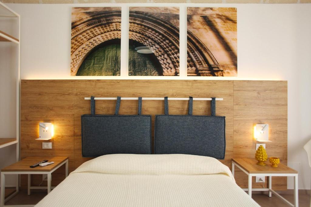 Postel nebo postele na pokoji v ubytování Gli Archi garden rooms
