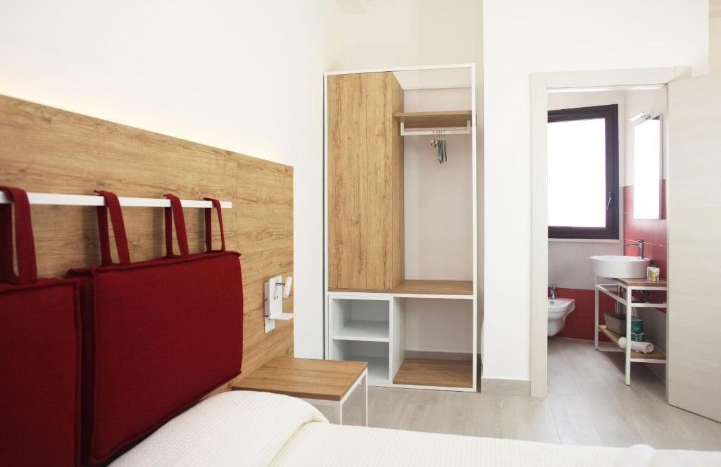 Postel nebo postele na pokoji v ubytování Gli Archi garden rooms
