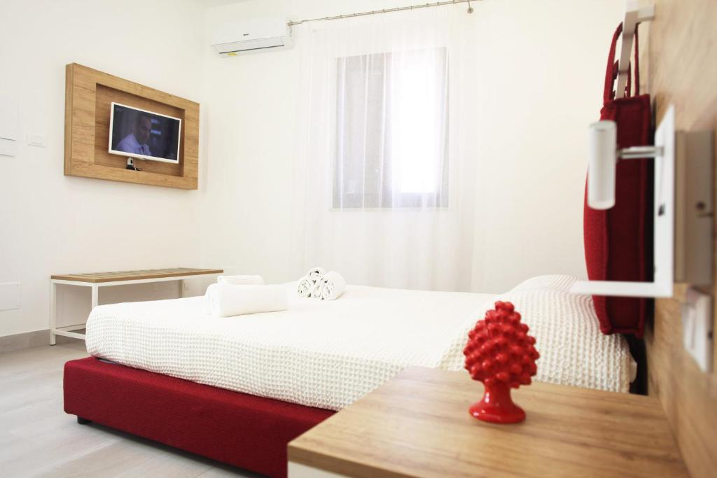 Postel nebo postele na pokoji v ubytování Gli Archi garden rooms