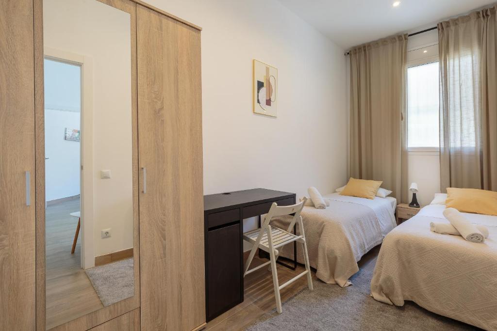 Posteľ alebo postele v izbe v ubytovaní Sagrada Familia Apartment