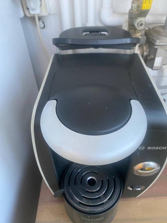 a black and white object with a face on it at Private room at Ceausescu's place in Old City Unirii Square in Bucharest