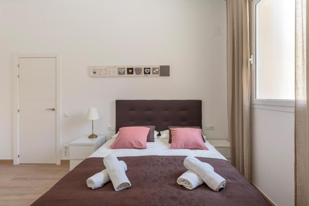 Posteľ alebo postele v izbe v ubytovaní Sagrada Familia Apartment